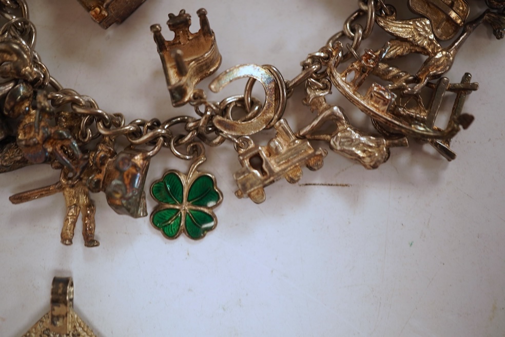 A white metal hunter keywind pocket watch, with Roman dial and subsidiary seconds, two silver charm bracelets and sundry items including jewellery and a silver sovereign case.